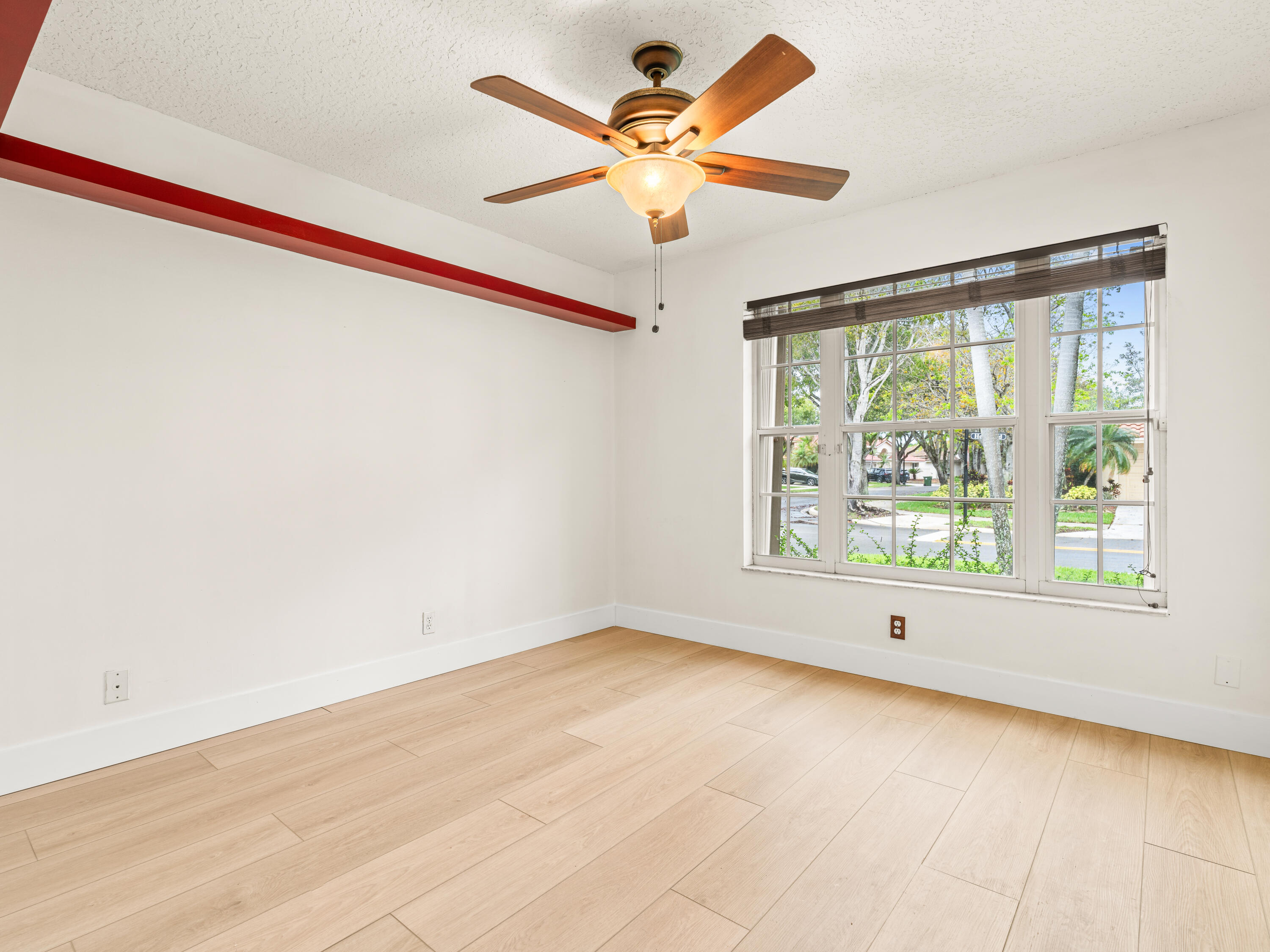833 Heron Road Weston, FL 33326 - Photo 20 of 34 a view of an empty room with a window
