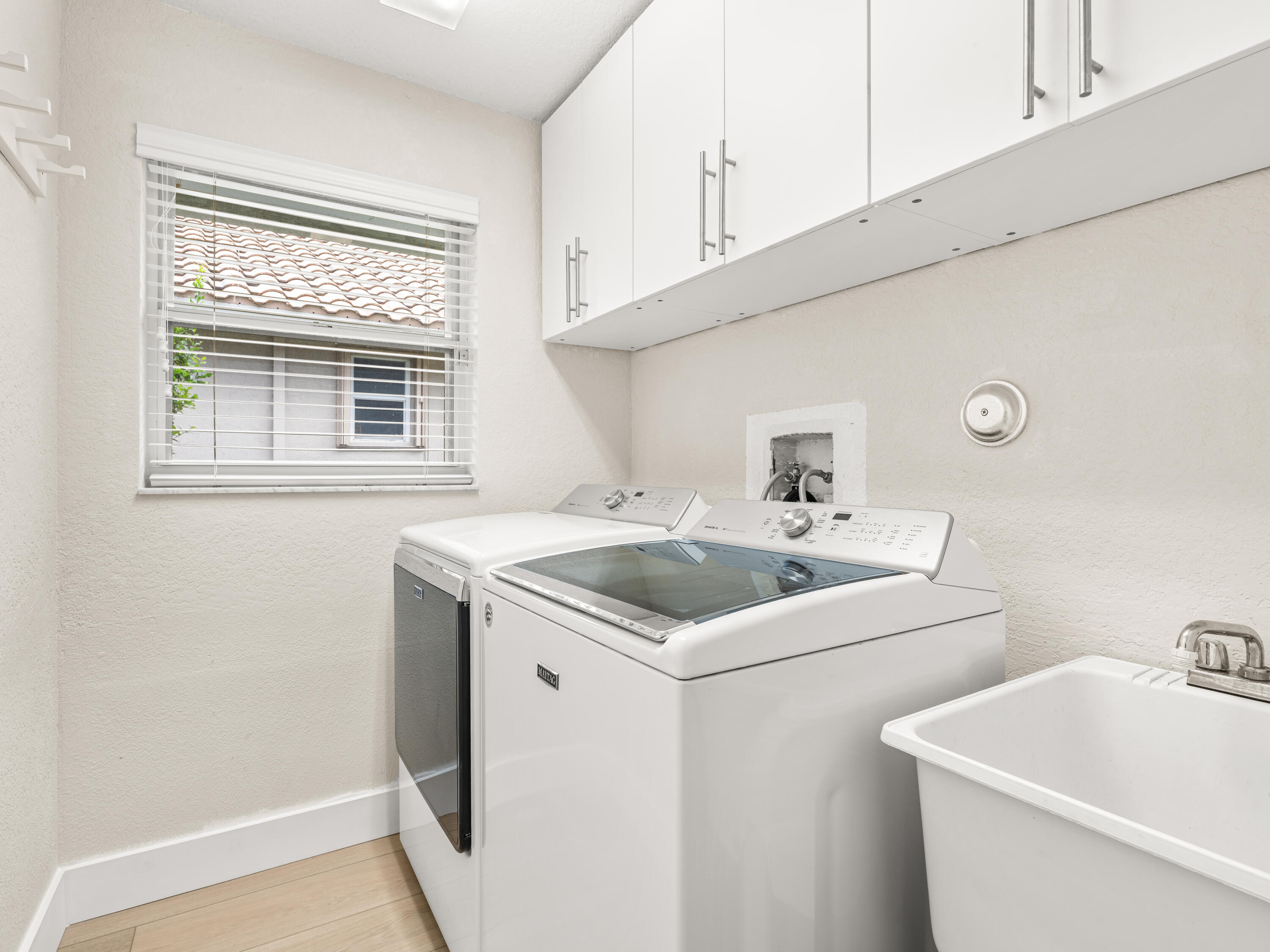 833 Heron Road Weston, FL 33326 - Photo 22 of 34 a bathroom with a sink and a toilet