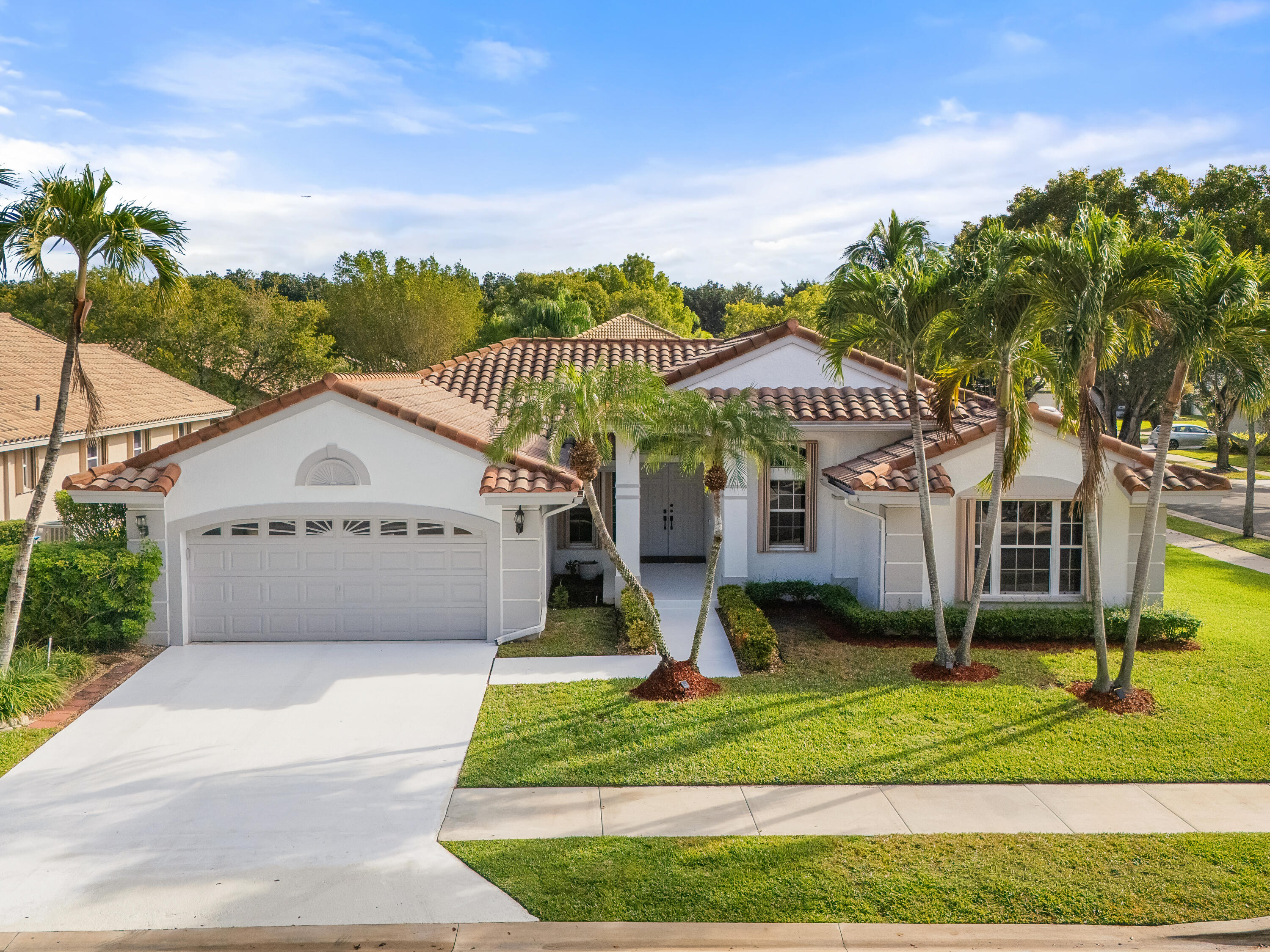 833 Heron Road Weston, FL 33326 - Photo 23 of 34 a view of a house with a yard