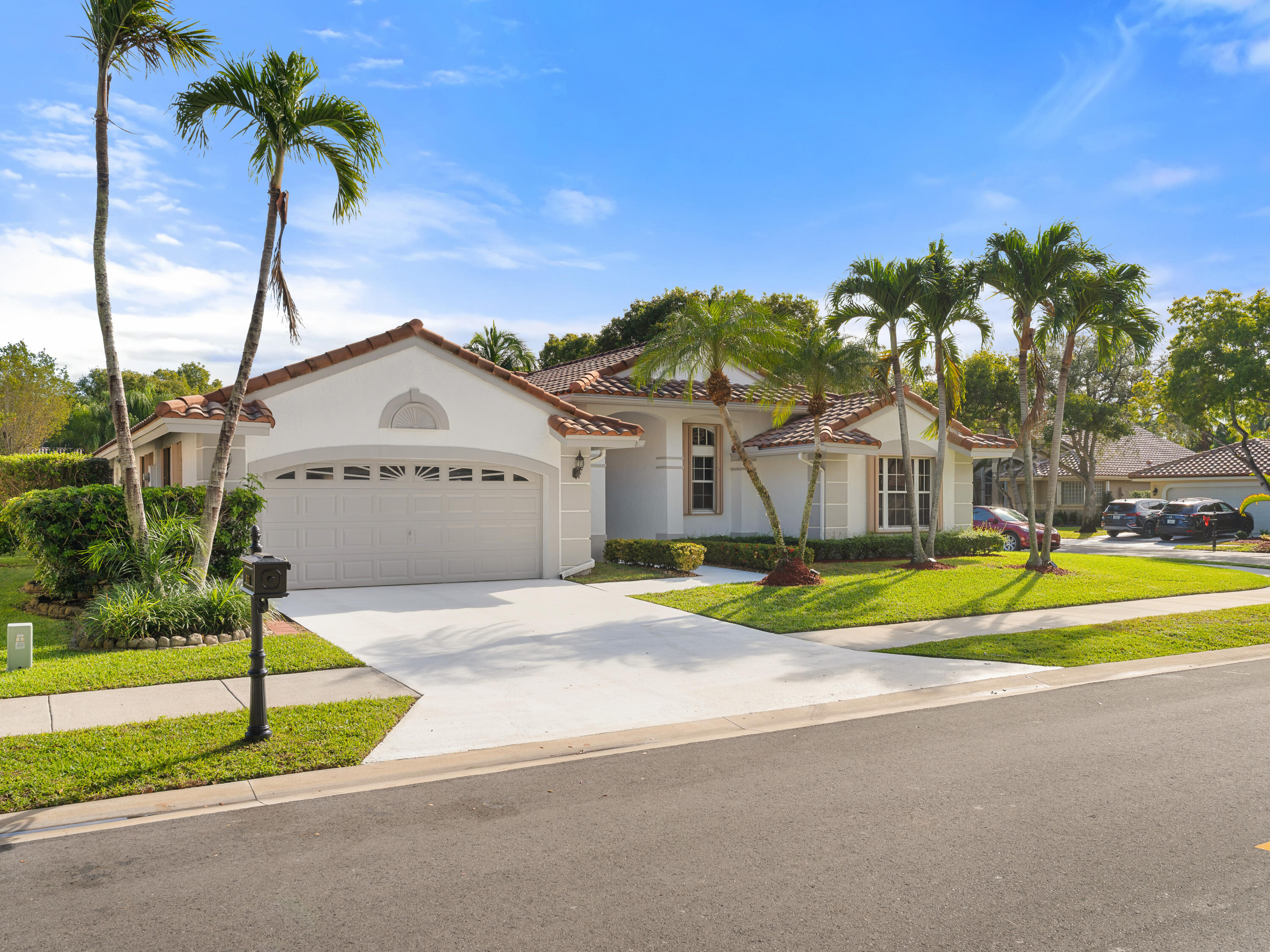 833 Heron Road Weston, FL 33326 - Photo 28 of 34 a view of swimming pool with a yard and palm trees