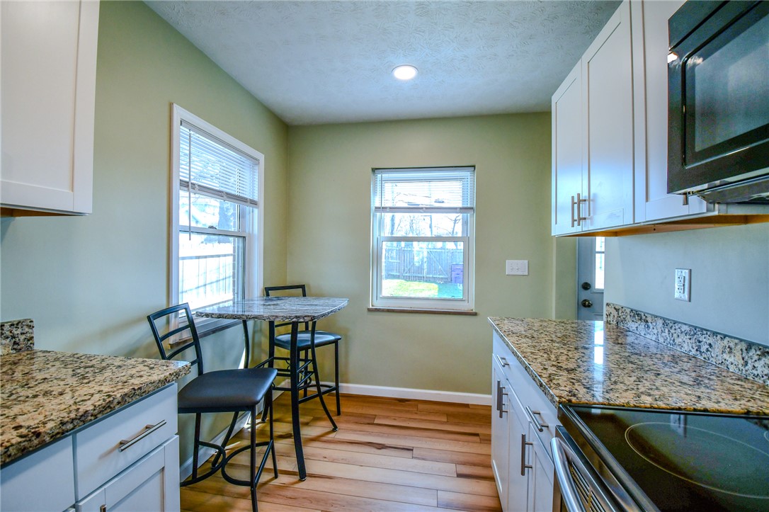 816 South Smithville Road Dayton, OH 45403 - Photo 12 of 33 This cozy kitchen features abundant counter space and bright windows, perfect for everyday meals.