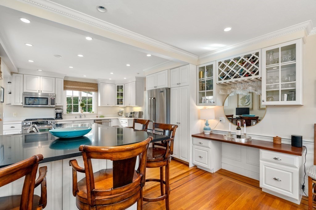 14 Hillcroft Road Boston, MA 02130 - Photo 11 of 34 a kitchen with sink a stove and chairs