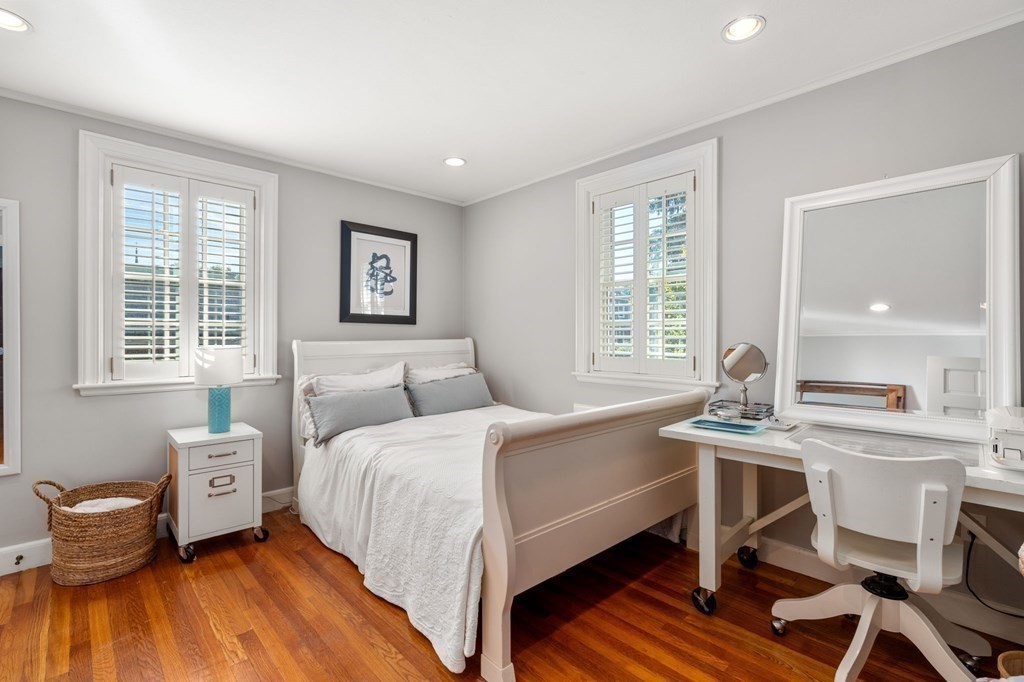 14 Hillcroft Road Boston, MA 02130 - Photo 21 of 34 a bedroom with a bed and a table