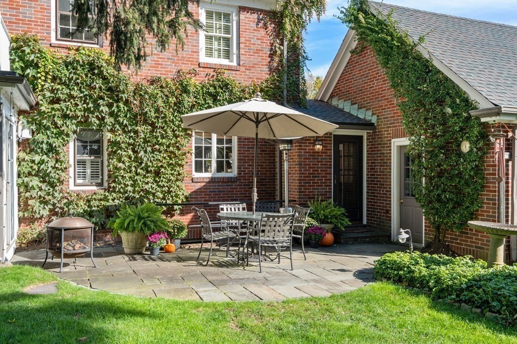 14 Hillcroft Road Boston, MA 02130 - Photo 26 of 34 a view of a chair and table in backyard of the house