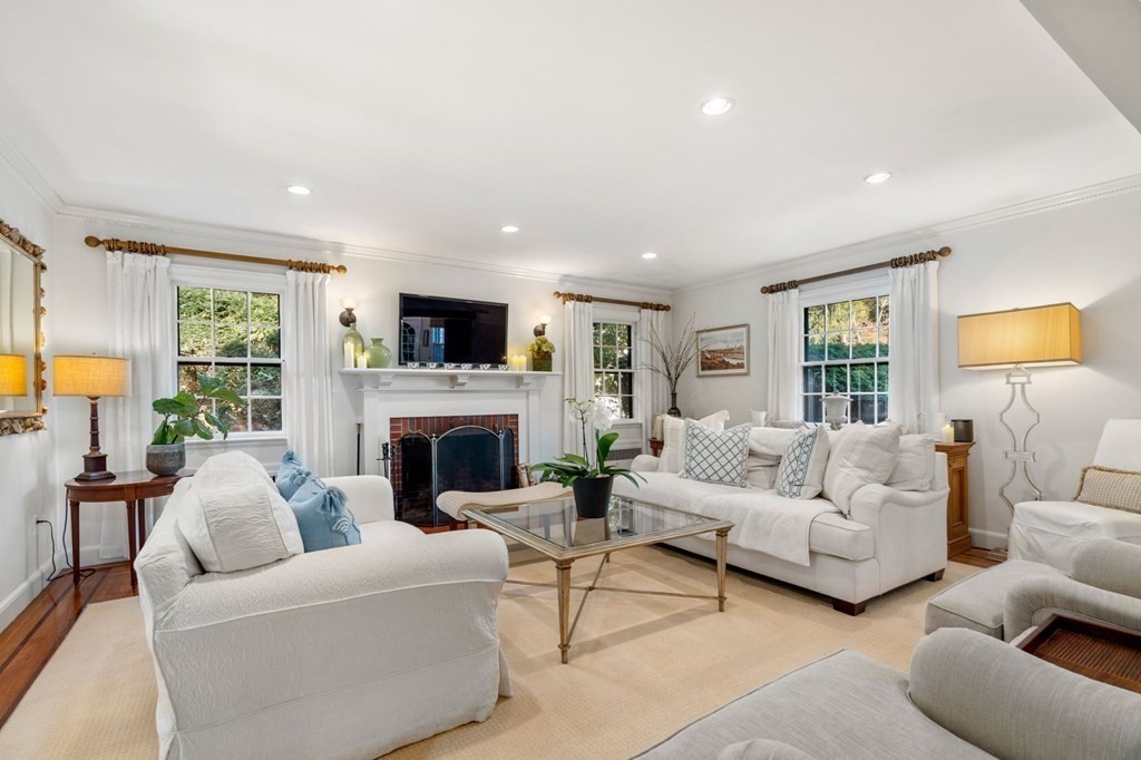 14 Hillcroft Road Boston, MA 02130 - Photo 3 of 34 a living room with furniture a fireplace and a large window