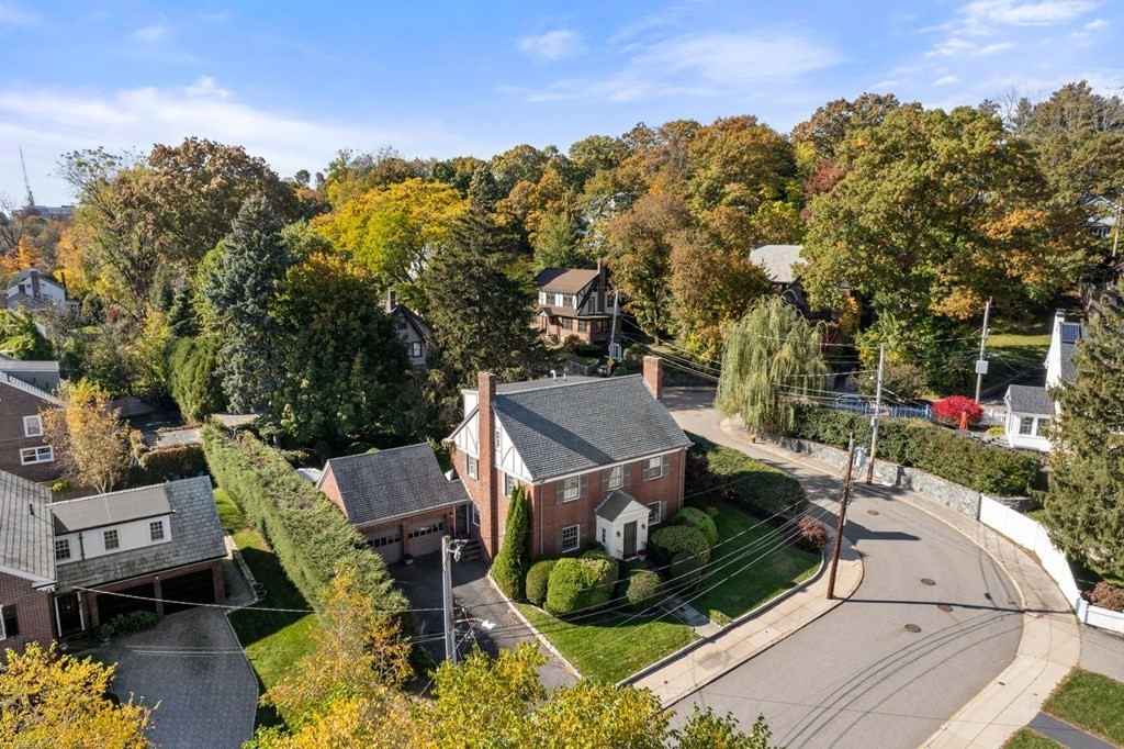 14 Hillcroft Road Boston, MA 02130 - Photo 31 of 34 an aerial view of a house with a yard fountain and a large tree