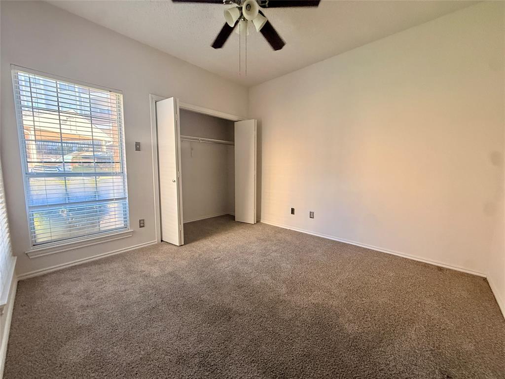 14277 Preston Road, Unit 512 Dallas, TX 75254 - Photo 5 of 8 an empty room with a empty space and windows