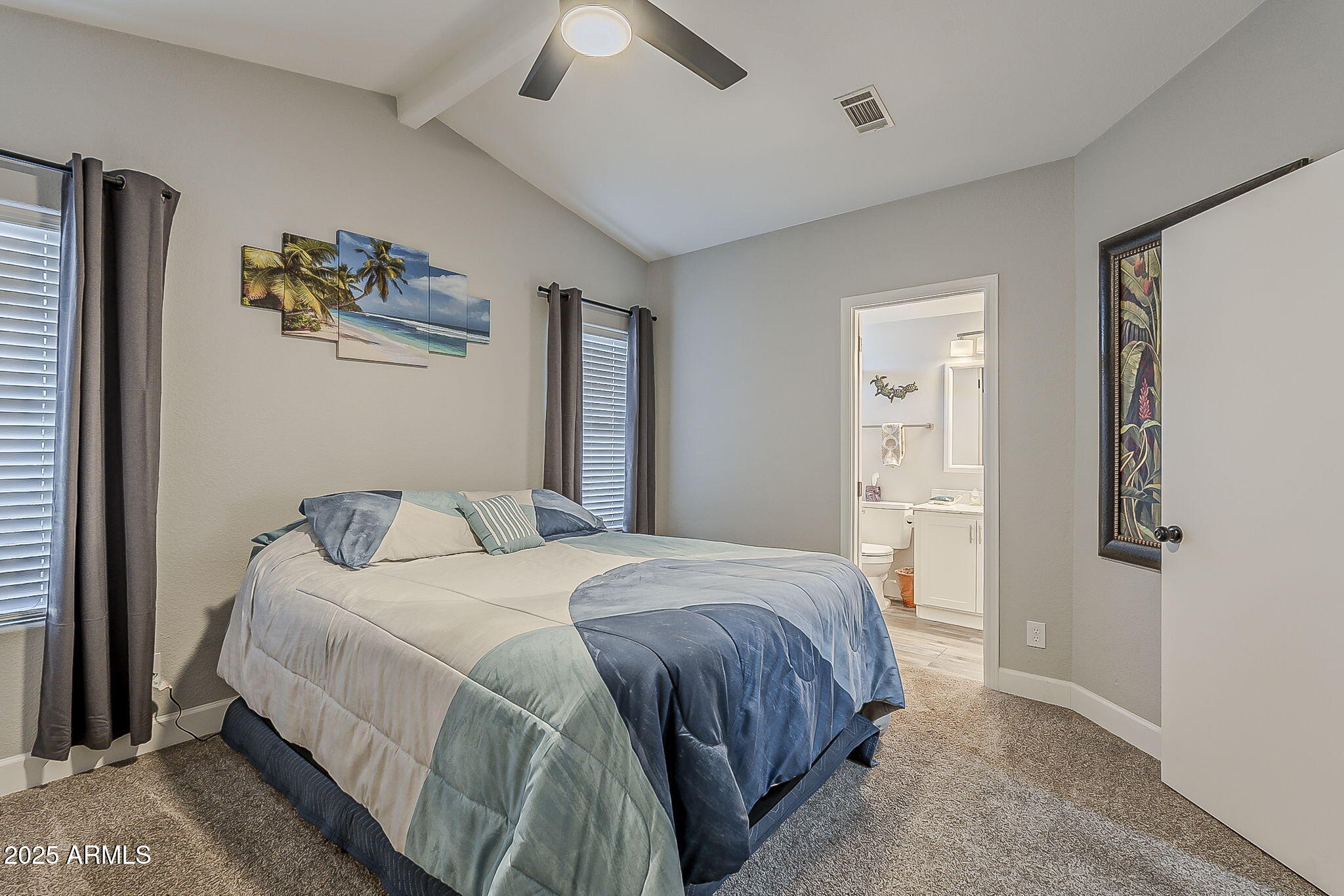 215 North Power Road, Unit 107 Mesa, AZ 85205 - Photo 11 of 49 a bedroom with a bed and a painting on the wall