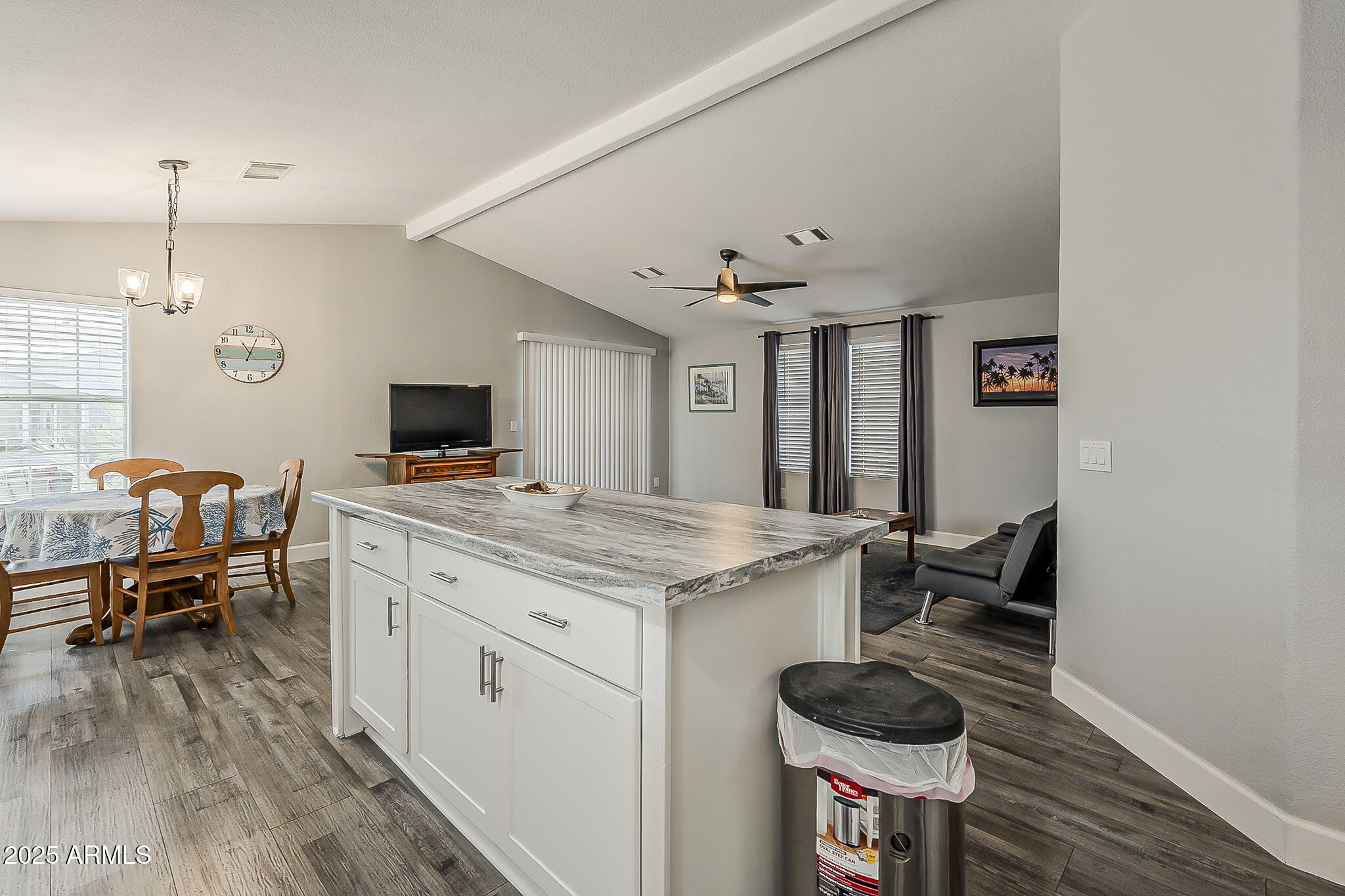 215 North Power Road, Unit 107 Mesa, AZ 85205 - Photo 19 of 49 a kitchen with granite countertop a stove and a wooden floor