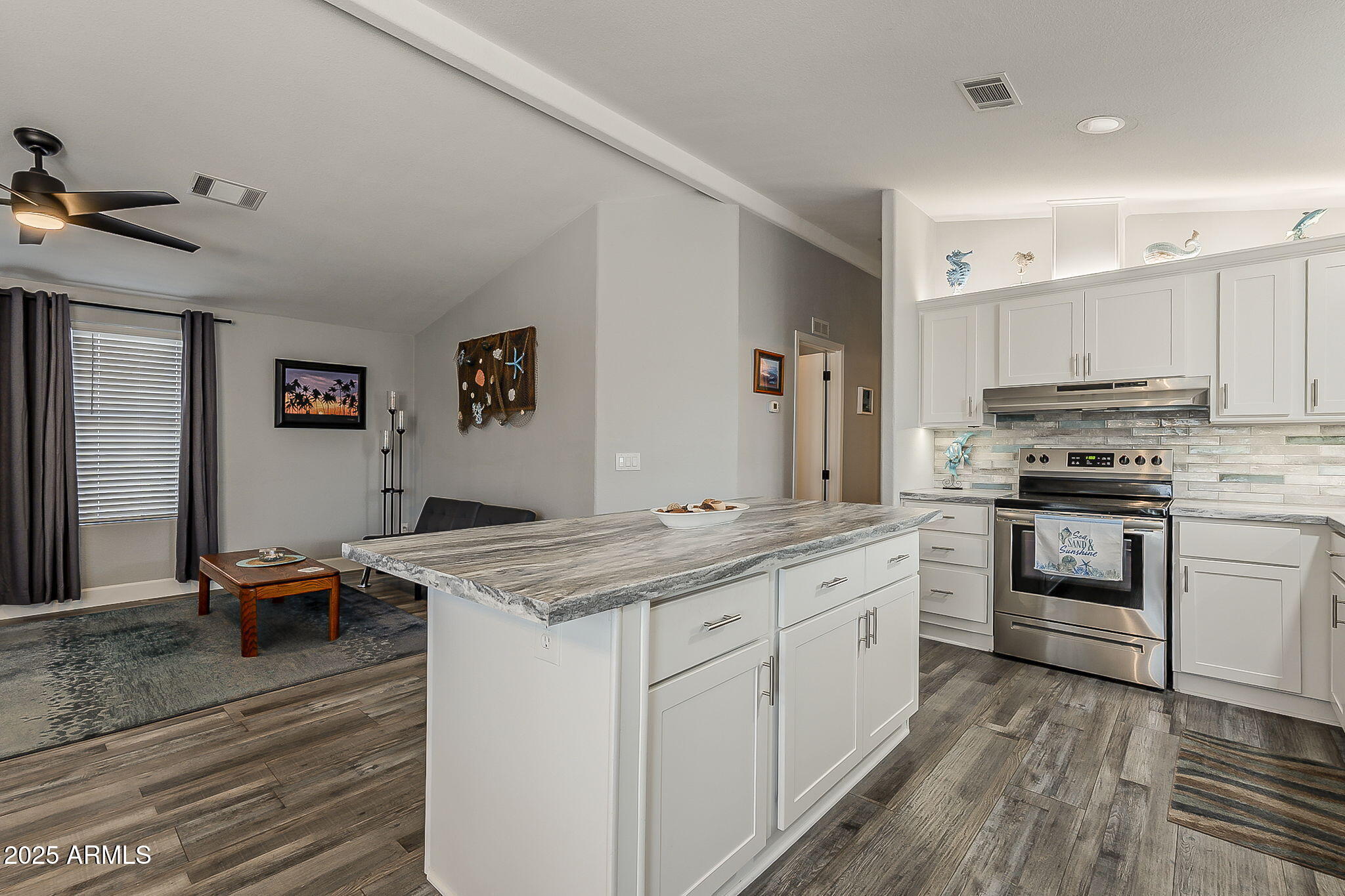 215 North Power Road, Unit 107 Mesa, AZ 85205 - Photo 2 of 49 a kitchen with stainless steel appliances granite countertop a sink stove and refrigerator