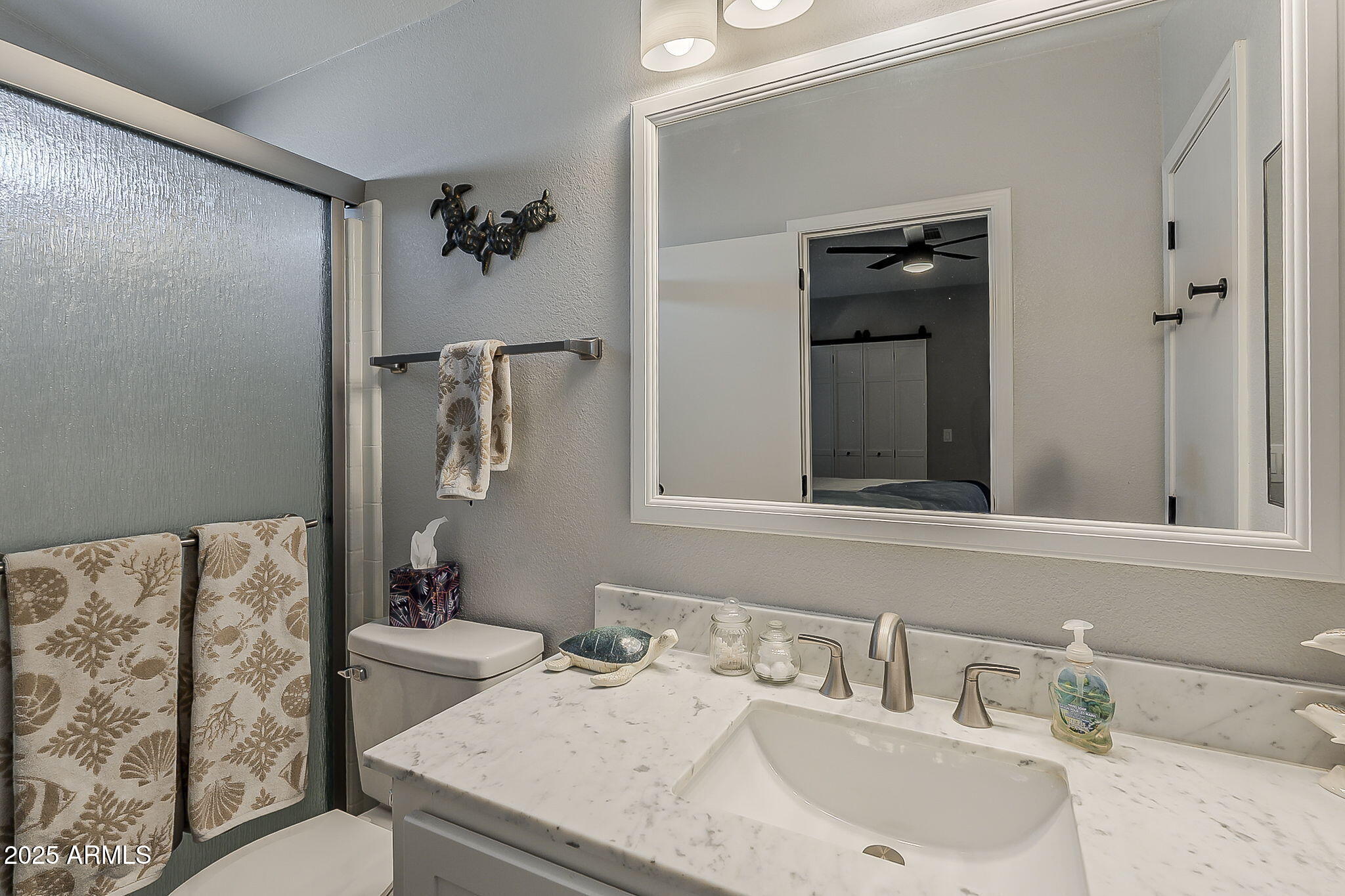 215 North Power Road, Unit 107 Mesa, AZ 85205 - Photo 23 of 49 a bathroom with a sink and a mirror