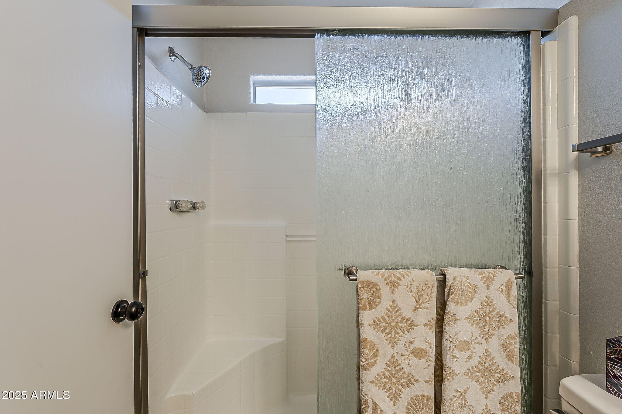 215 North Power Road, Unit 107 Mesa, AZ 85205 - Photo 24 of 49 a bathroom with a bathtub and shower