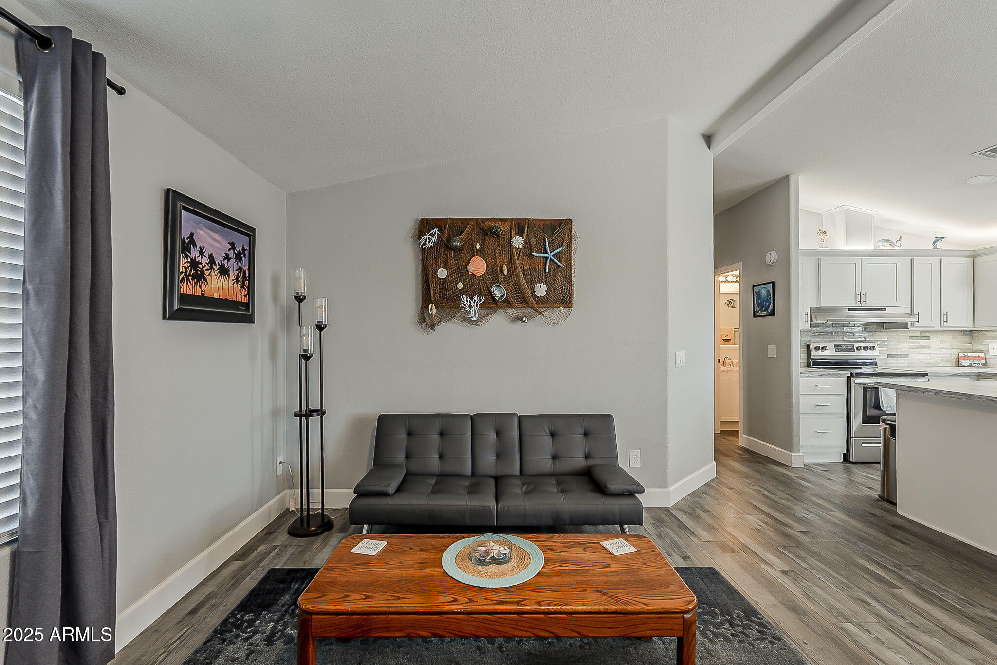 215 North Power Road, Unit 107 Mesa, AZ 85205 - Photo 28 of 49 a living room with stainless steel appliances furniture a rug and a window