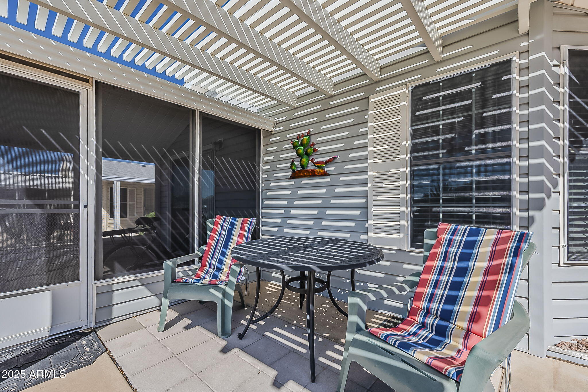 215 North Power Road, Unit 107 Mesa, AZ 85205 - Photo 3 of 49 a view of dinning table and chairs in patio