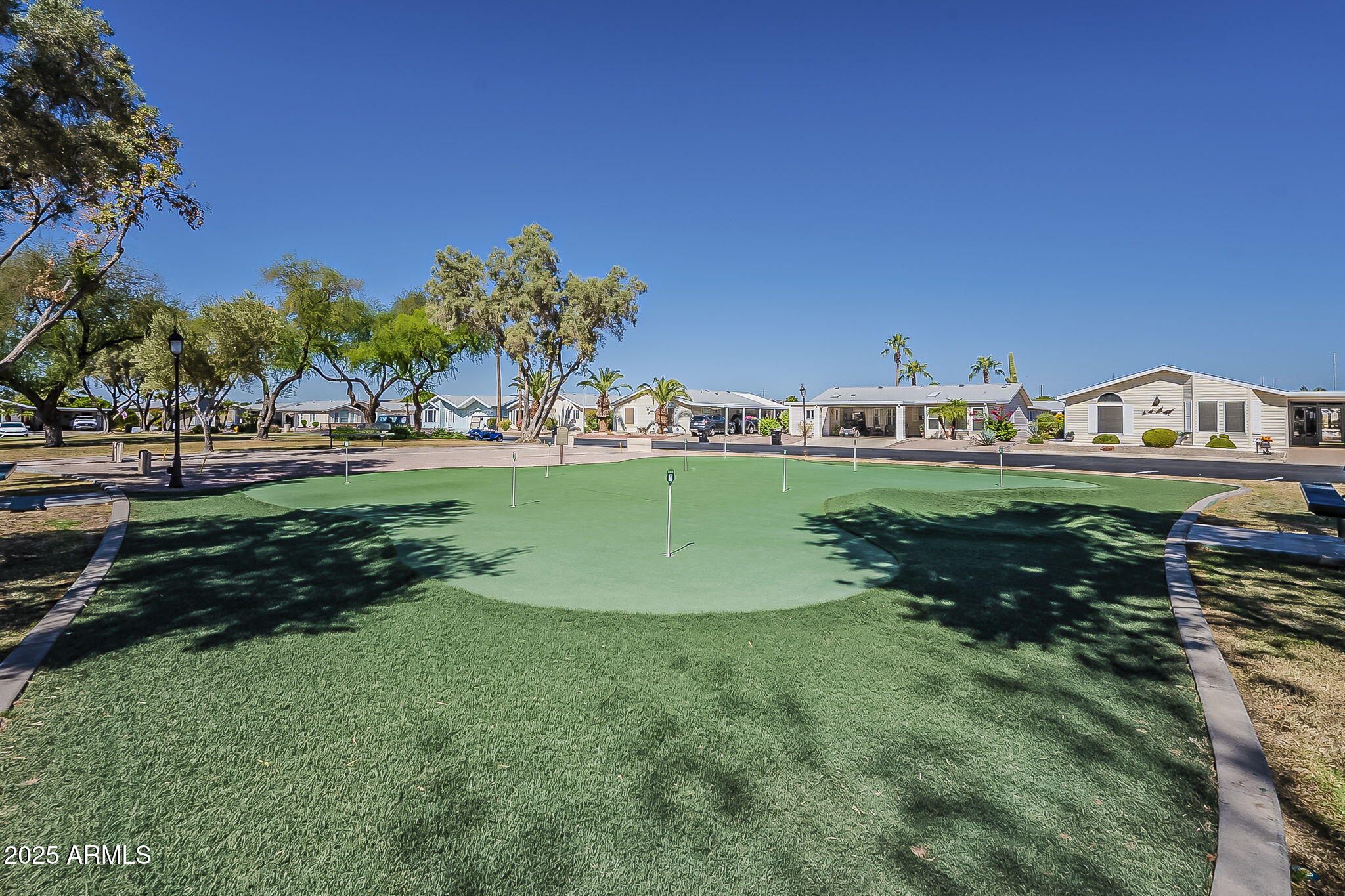 215 North Power Road, Unit 107 Mesa, AZ 85205 - Photo 33 of 49 a view of a lake with houses