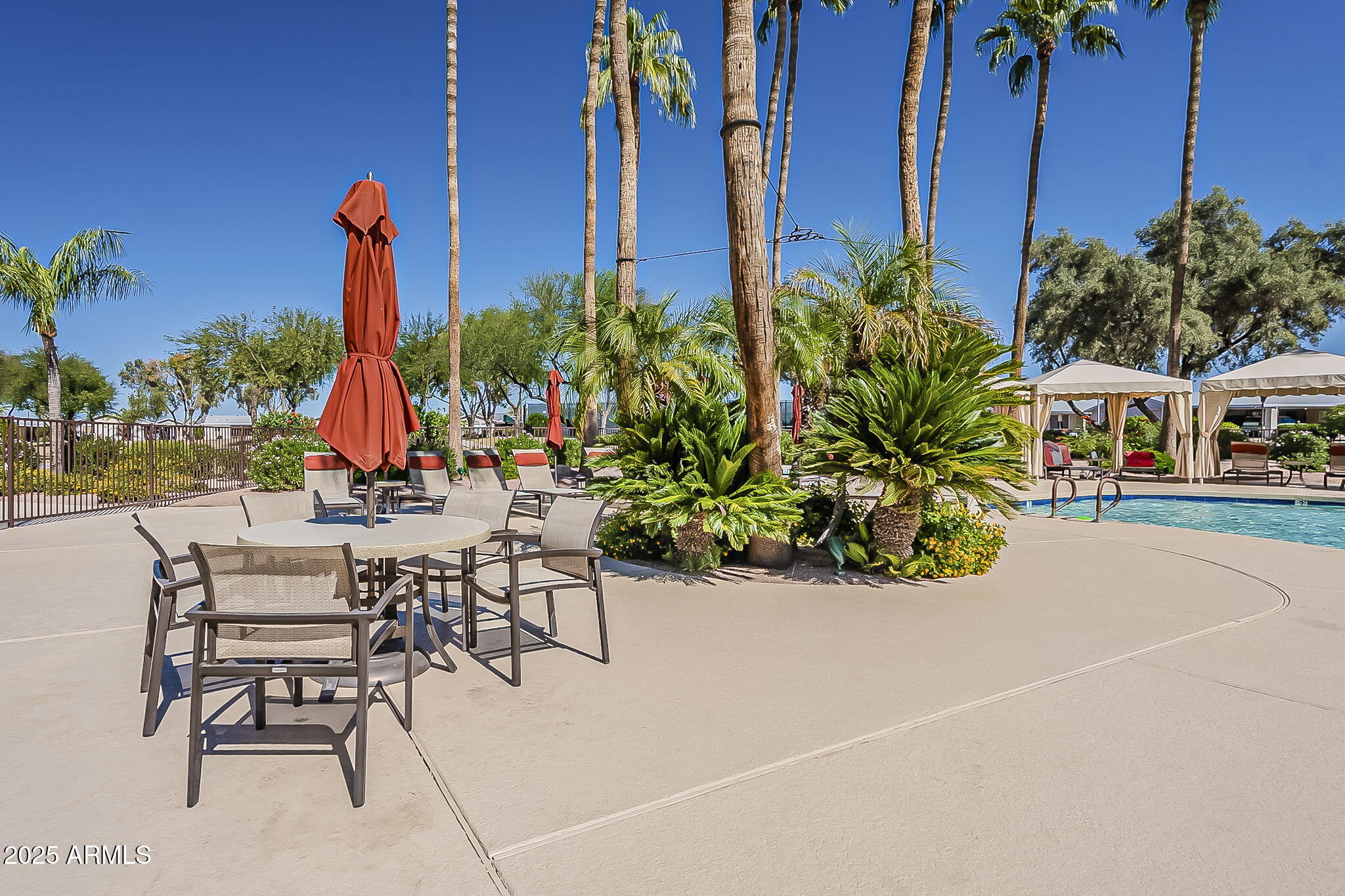 215 North Power Road, Unit 107 Mesa, AZ 85205 - Photo 42 of 49 a view of a swimming pool with outdoor seating