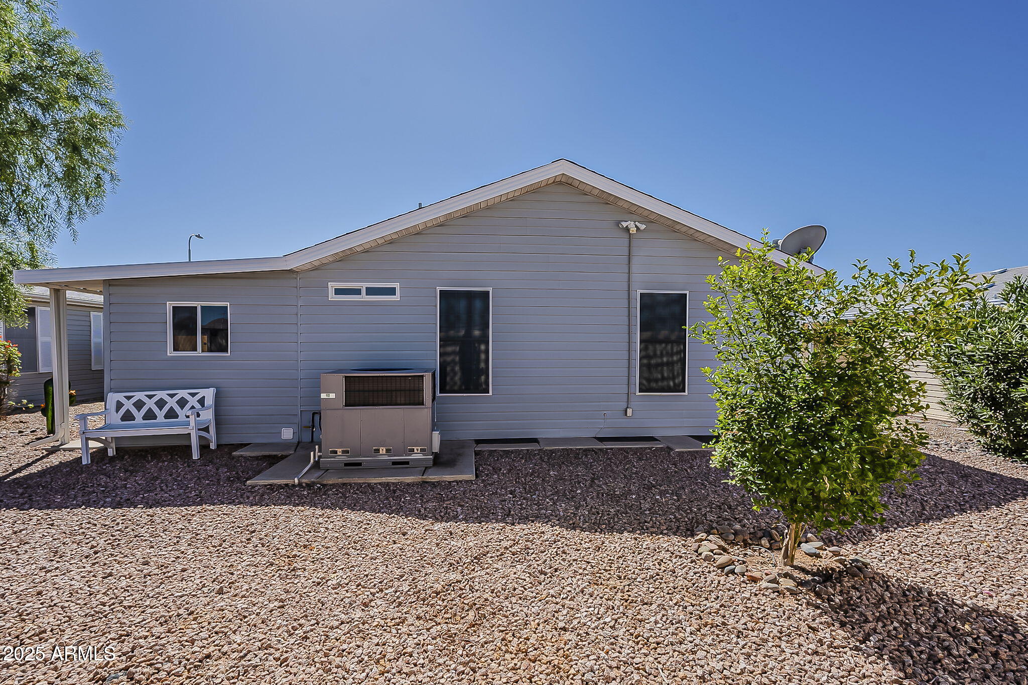 215 North Power Road, Unit 107 Mesa, AZ 85205 - Photo 47 of 49 a front view of a house with a yard