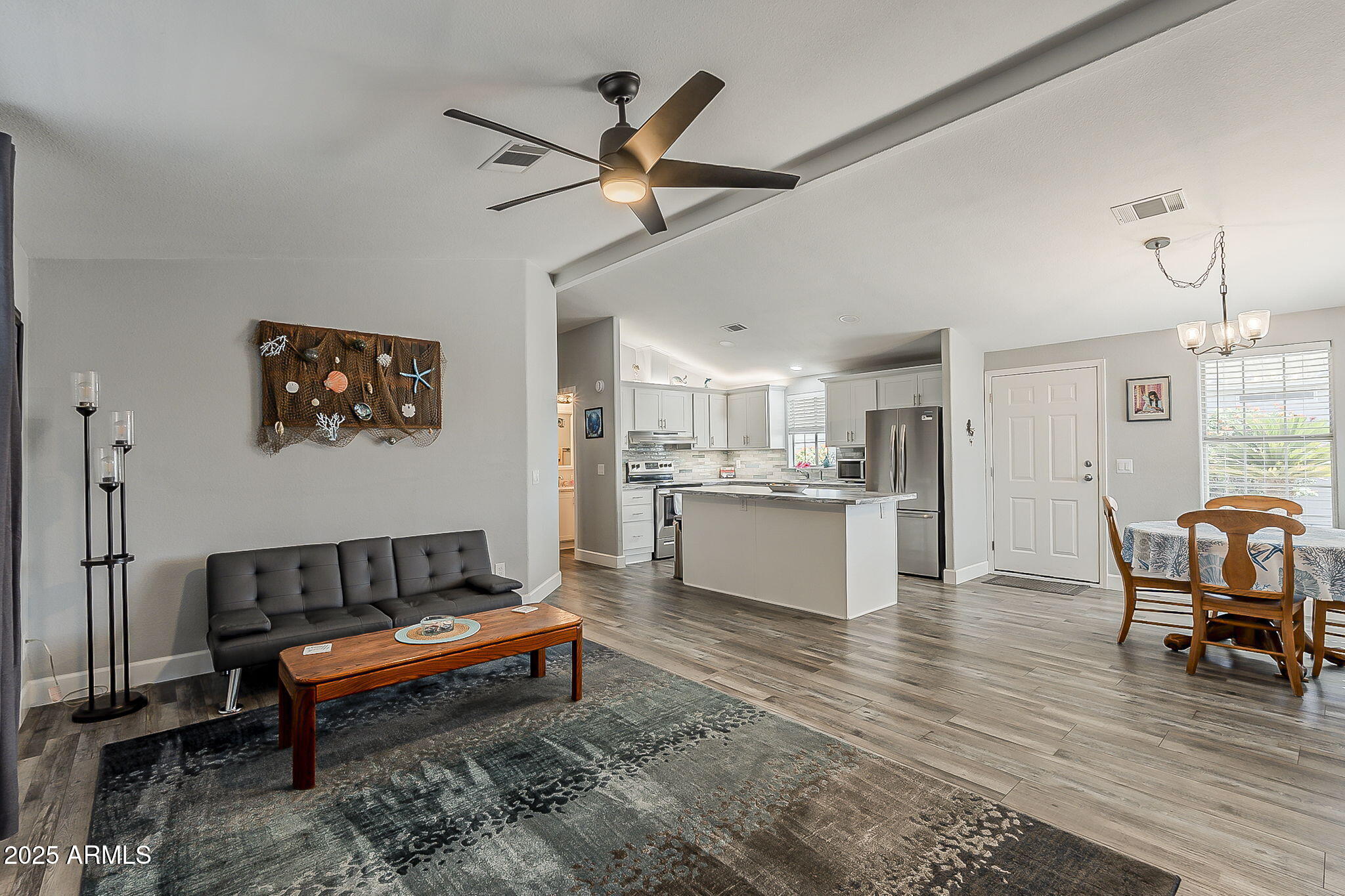 215 North Power Road, Unit 107 Mesa, AZ 85205 - Photo 5 of 49 a living room with kitchen and furniture