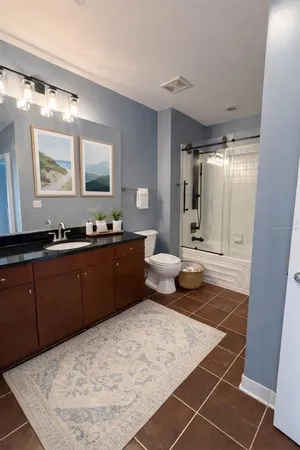 a bedroom with a bed and a walk in closet