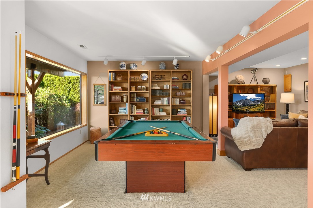4910 23rd Avenue West Everett, WA 98203 - Photo 21 of 40 a living room with furniture a flat screen tv and a large window