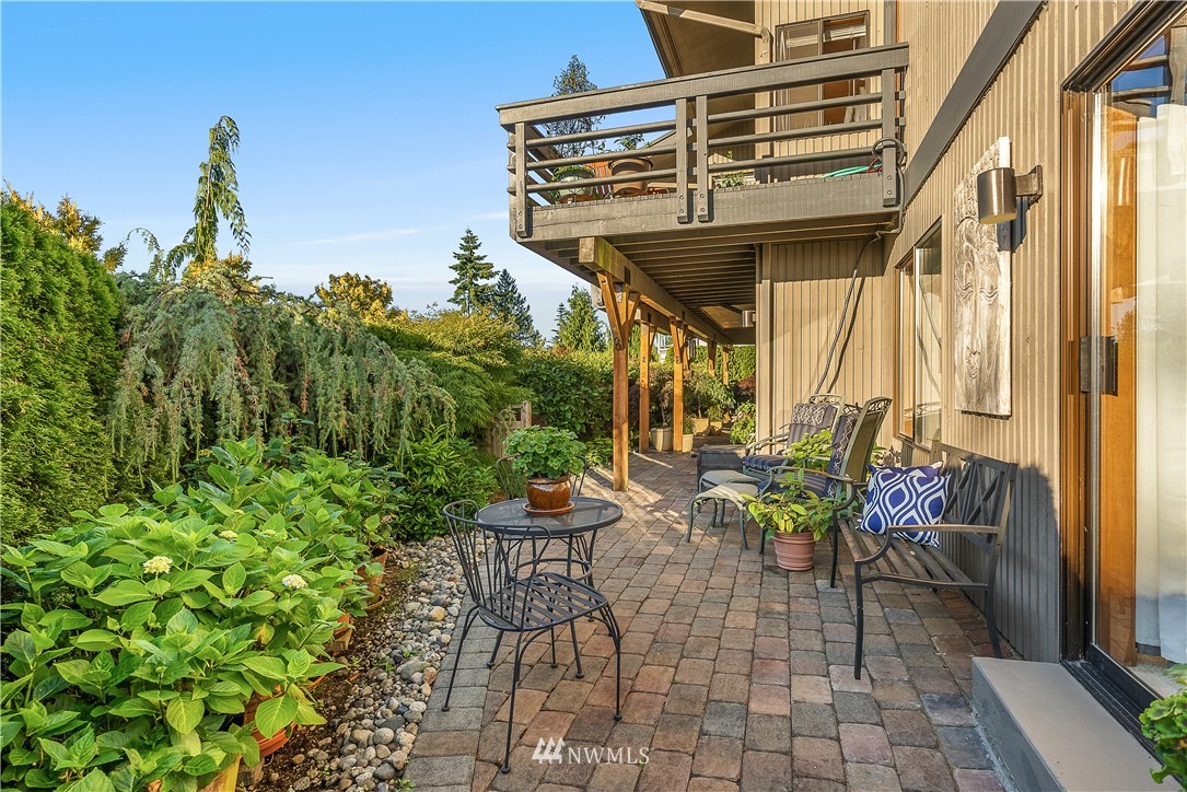 4910 23rd Avenue West Everett, WA 98203 - Photo 31 of 40 a view of a patio with table and chairs and potted plants