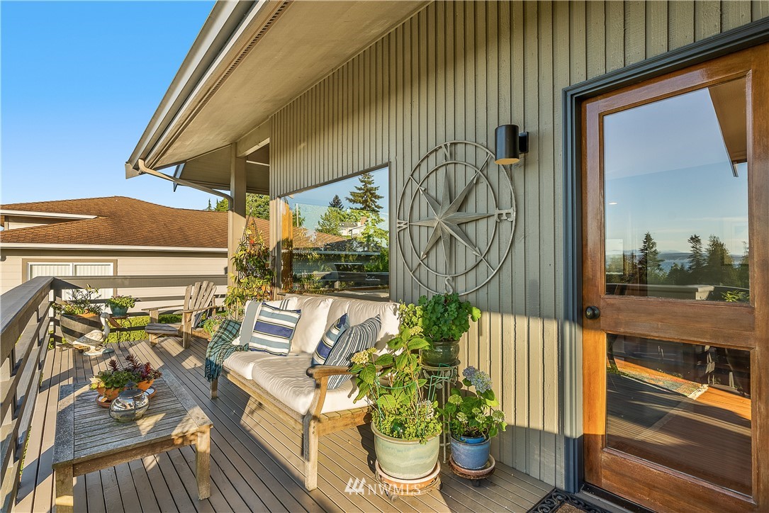 4910 23rd Avenue West Everett, WA 98203 - Photo 32 of 40 a view of a balcony with chairs and a potted plant