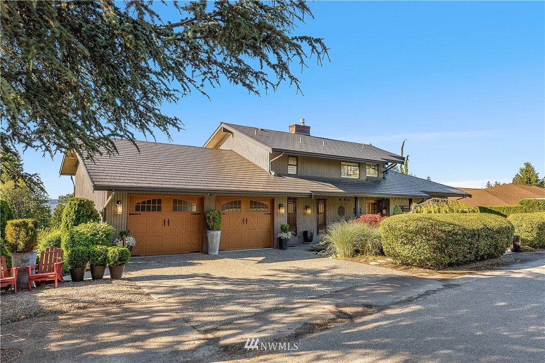 4910 23rd Avenue West Everett, WA 98203 - Photo 39 of 40 a front view of a house with a garden