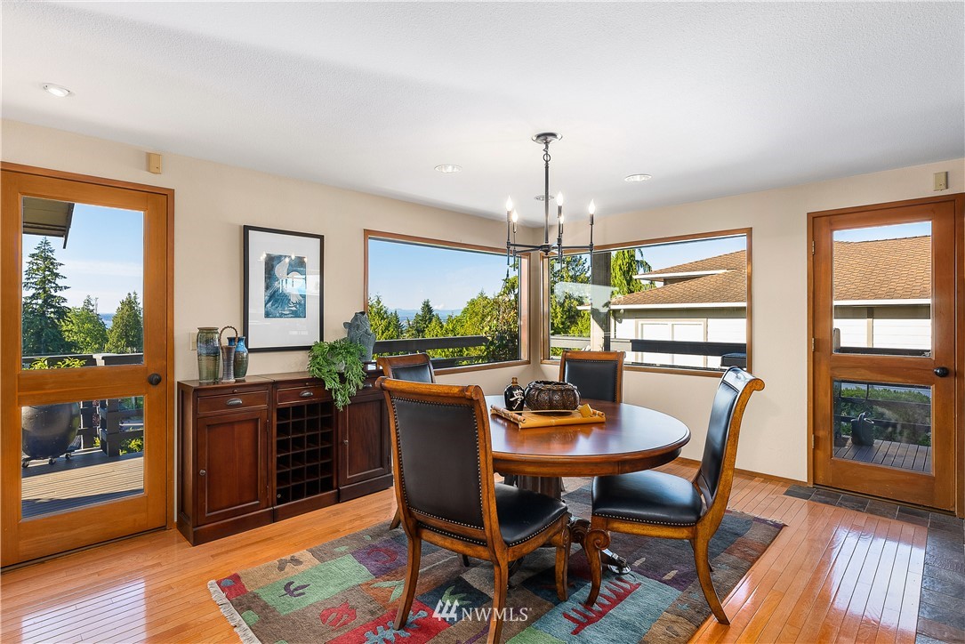 4910 23rd Avenue West Everett, WA 98203 - Photo 10 of 40 a view of a dining room with furniture window and wooden floor