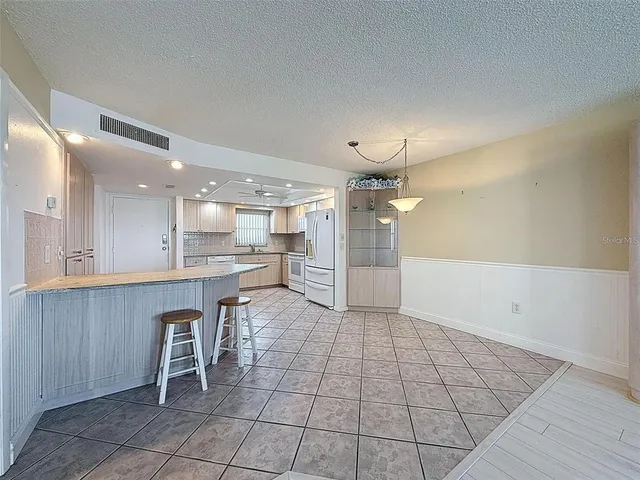 a view of kitchen with furniture and window