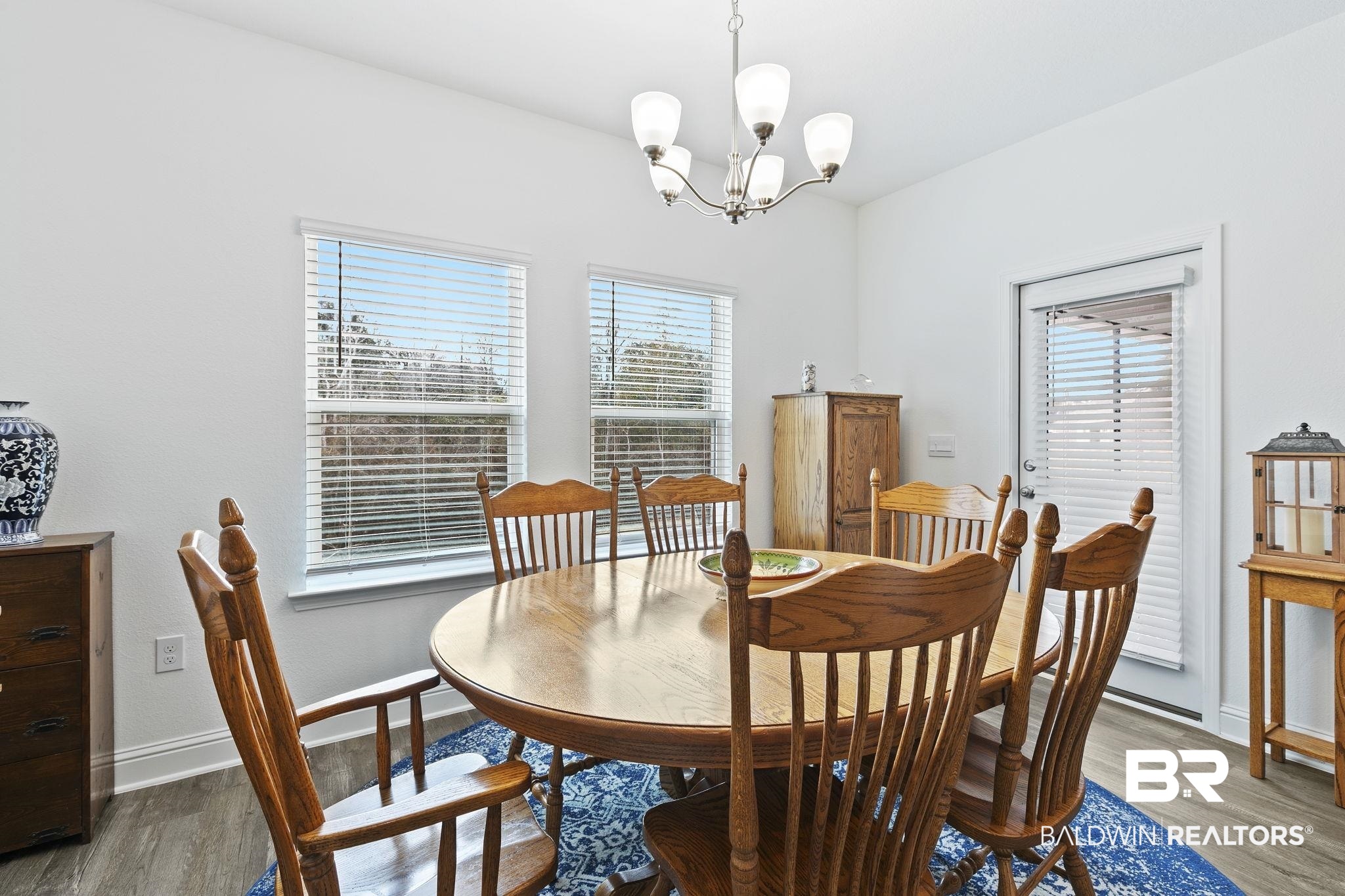 1141 Pencarro Boulevard Foley, AL 36535 - Photo 26 of 70 Dining room with hardwood / wood-style floors and a notable chandelier