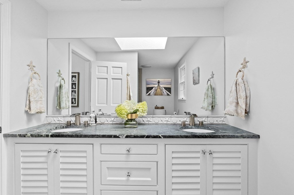 6 Pheasant Run Hingham, MA 02043 - Photo 23 of 41 a bathroom with a granite countertop sink and a mirror