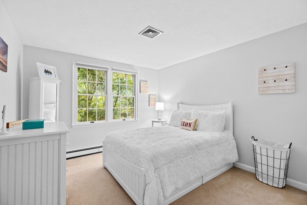 6 Pheasant Run Hingham, MA 02043 - Photo 25 of 41 a bedroom with a bed and a couch