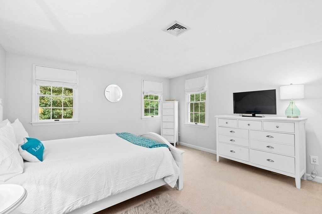 6 Pheasant Run Hingham, MA 02043 - Photo 28 of 41 a bedroom with a bed and a flat screen tv