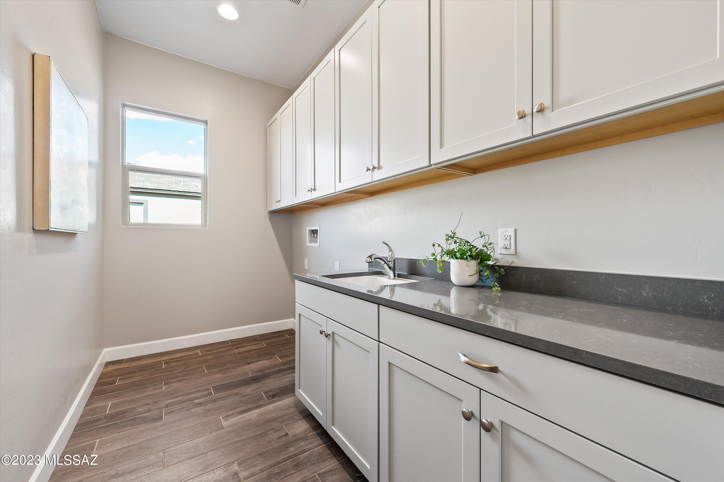 13169 North Vistoso Rnch Place Oro Valley, AZ 85755 - Photo 26 of 29 a kitchen with stainless steel appliances white cabinets and a sink