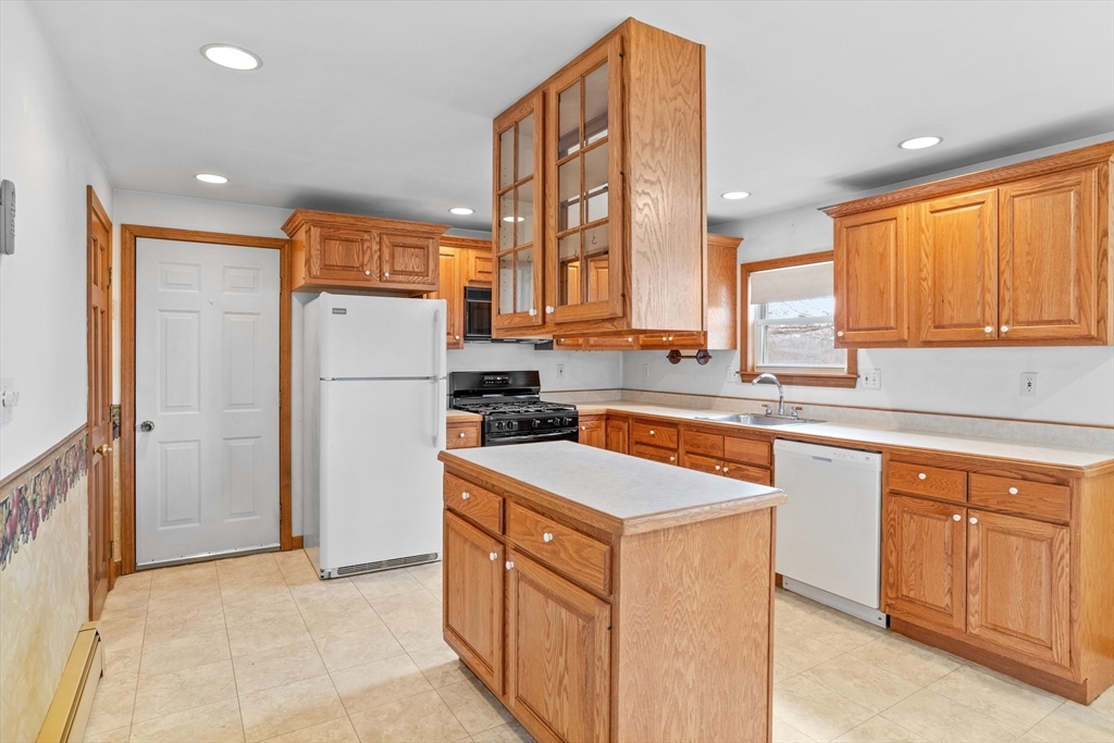 13 Lexington Road Billerica, MA 01821 - Photo 12 of 25 a kitchen with a refrigerator a sink and dishwasher