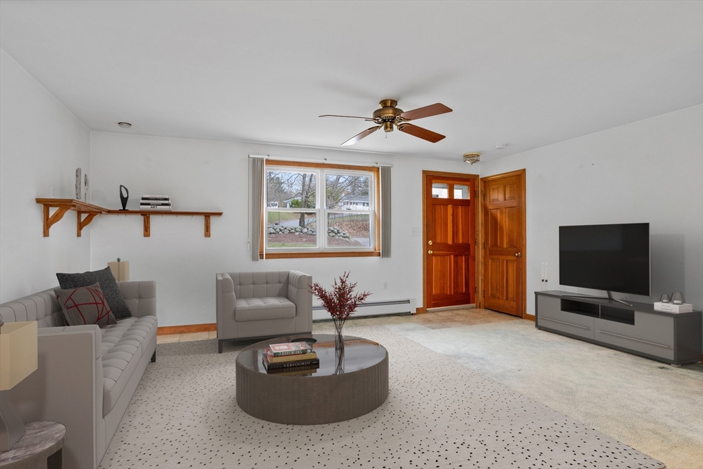 13 Lexington Road Billerica, MA 01821 - Photo 13 of 25 a living room with furniture and a flat screen tv