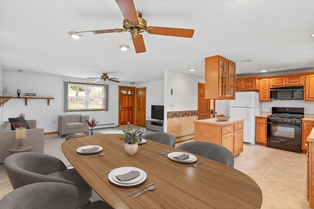 13 Lexington Road Billerica, MA 01821 - Photo 14 of 25 a open dining room with furniture kitchen view and a chandelier