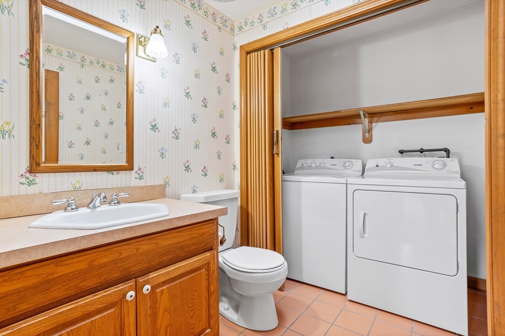 13 Lexington Road Billerica, MA 01821 - Photo 15 of 25 a bathroom with a sink a toilet and shower