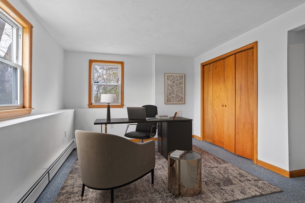13 Lexington Road Billerica, MA 01821 - Photo 17 of 25 a living room with furniture a window and a lamp