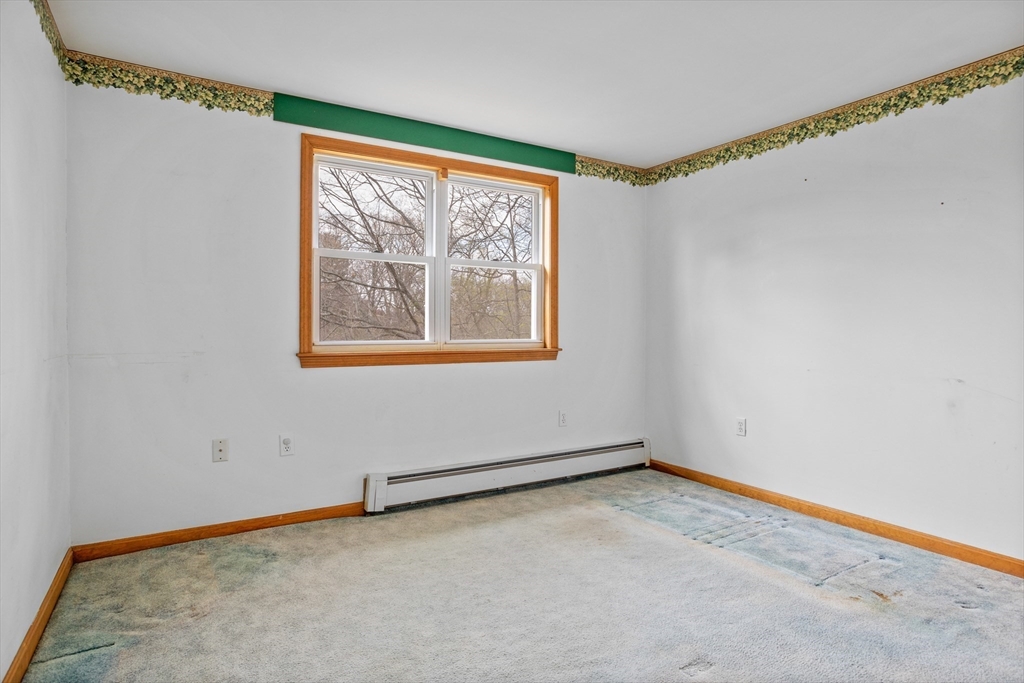 13 Lexington Road Billerica, MA 01821 - Photo 19 of 25 a view of an empty room with a window