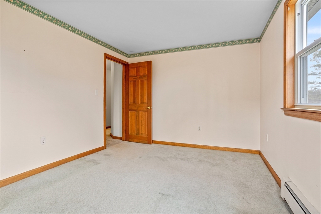 13 Lexington Road Billerica, MA 01821 - Photo 20 of 25 a view of an empty room with a window