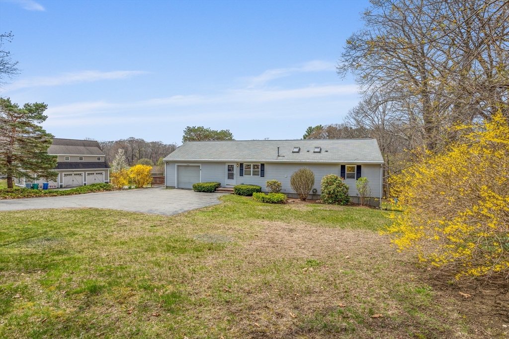 13 Lexington Road Billerica, MA 01821 - Photo 3 of 25 a front view of house with yard and trees in the background