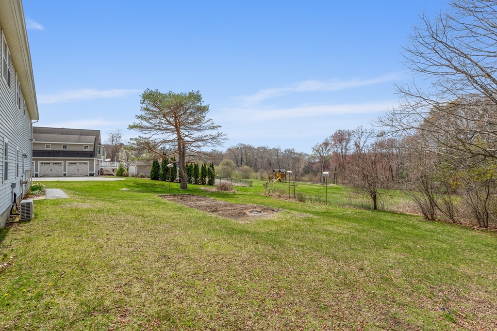 13 Lexington Road Billerica, MA 01821 - Photo 8 of 25 a view of a playground with basketball court
