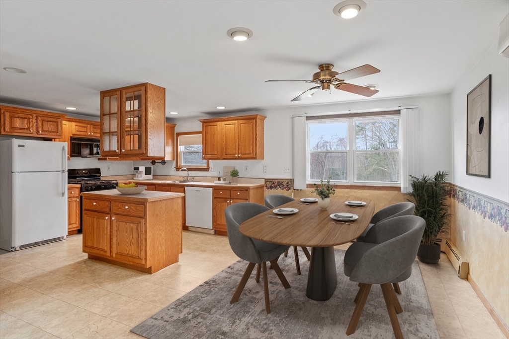 13 Lexington Road Billerica, MA 01821 - Photo 10 of 25 a view of a dining room with furniture window and outside view