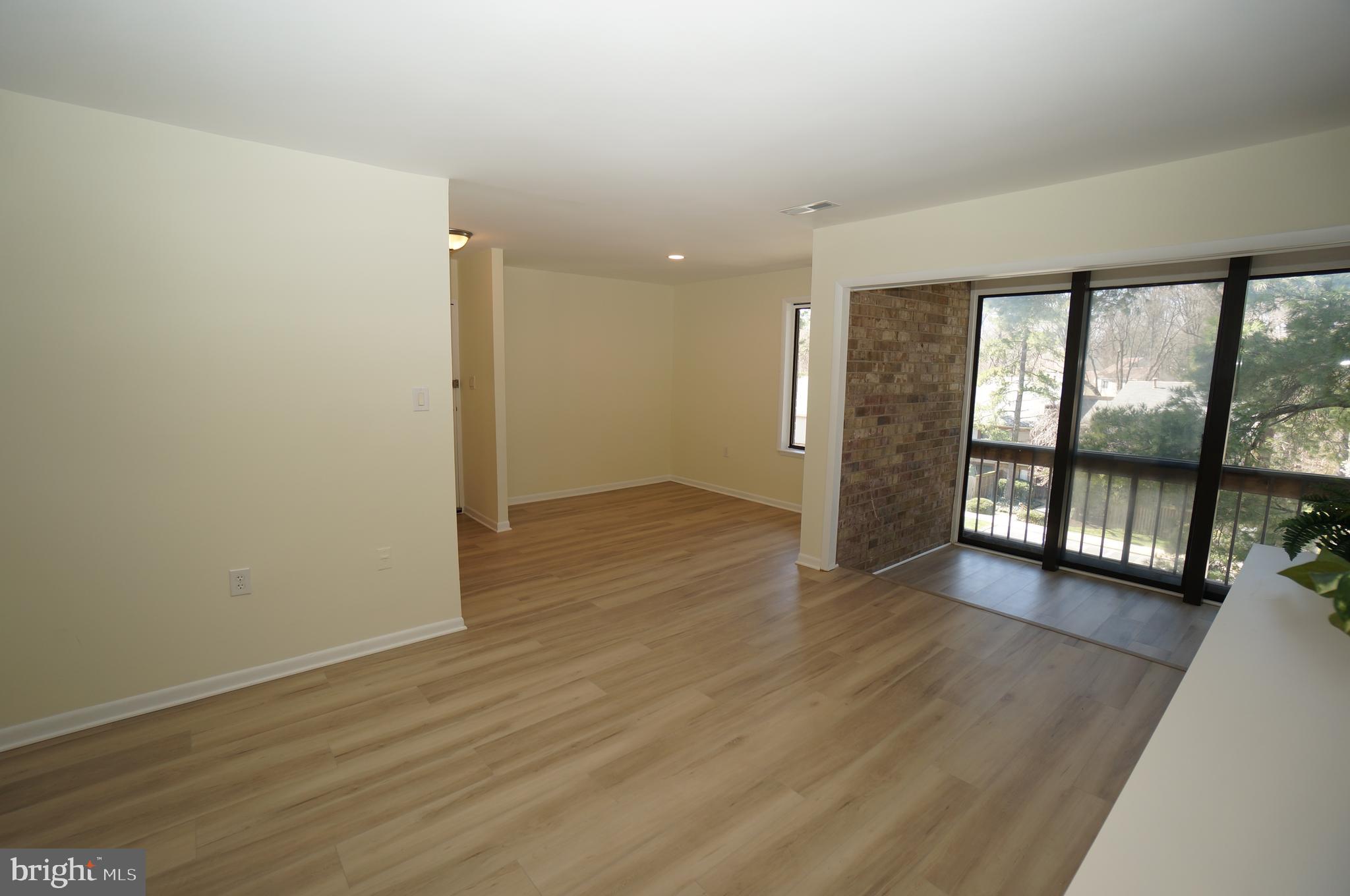 10551 Twin Rivers Road, Unit E1 Columbia, MD 21044 - Photo 3 of 22 Living, Dining & Sunroom