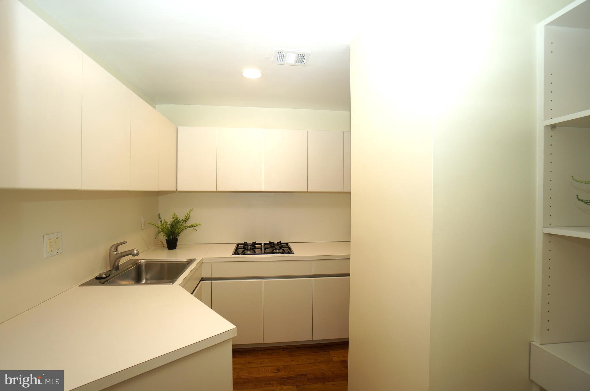 10551 Twin Rivers Road, Unit E1 Columbia, MD 21044 - Photo 9 of 22 Remodeled Kitchen Quality White Cabinetry
