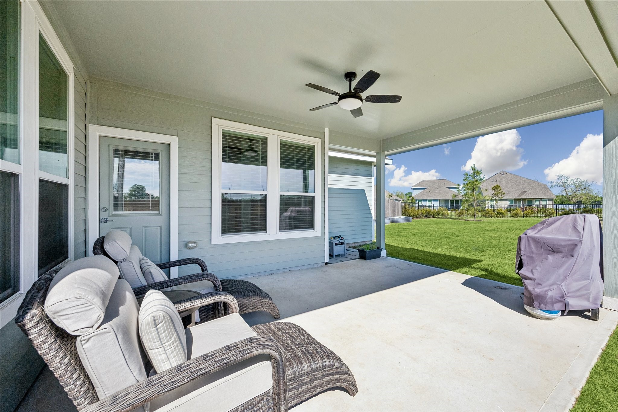 33002 Carolyns Perfection Loop Fulshear, TX 77441 - Photo 6 of 29 Covered patio with fan is perfect to enjoy the outdoors no matter the weather.