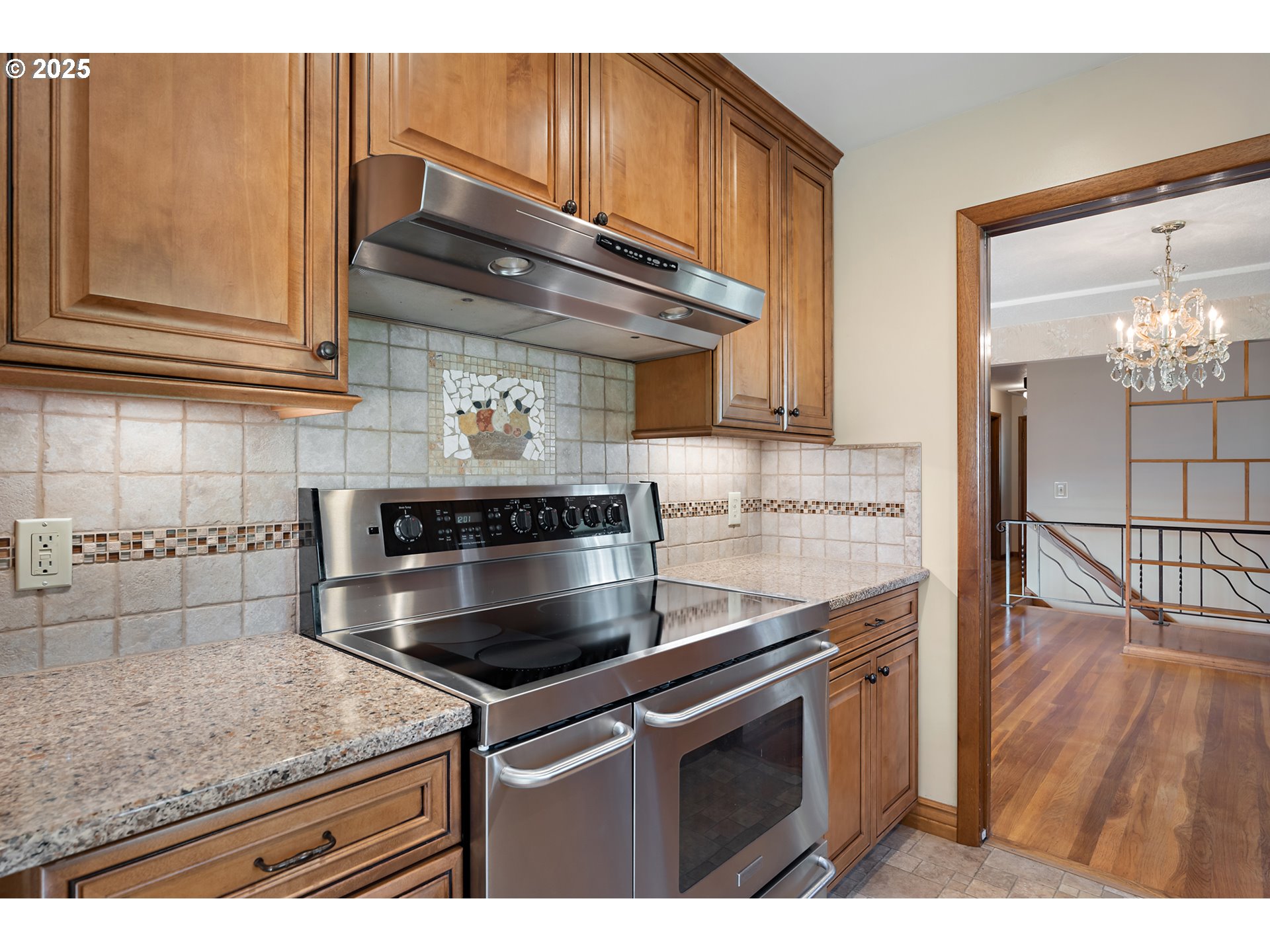 4430 Southeast Flavel Street Portland, OR 97206 - Photo 11 of 43 a kitchen with stainless steel appliances granite countertop a sink a stove and cabinets