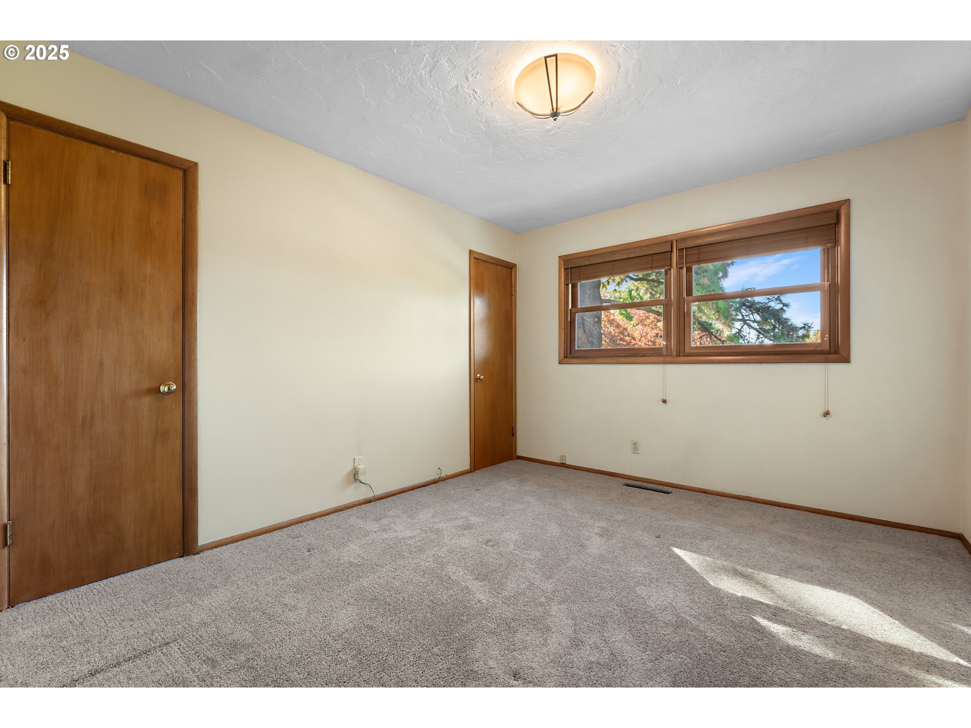 4430 Southeast Flavel Street Portland, OR 97206 - Photo 20 of 43 a view of an empty room with a window