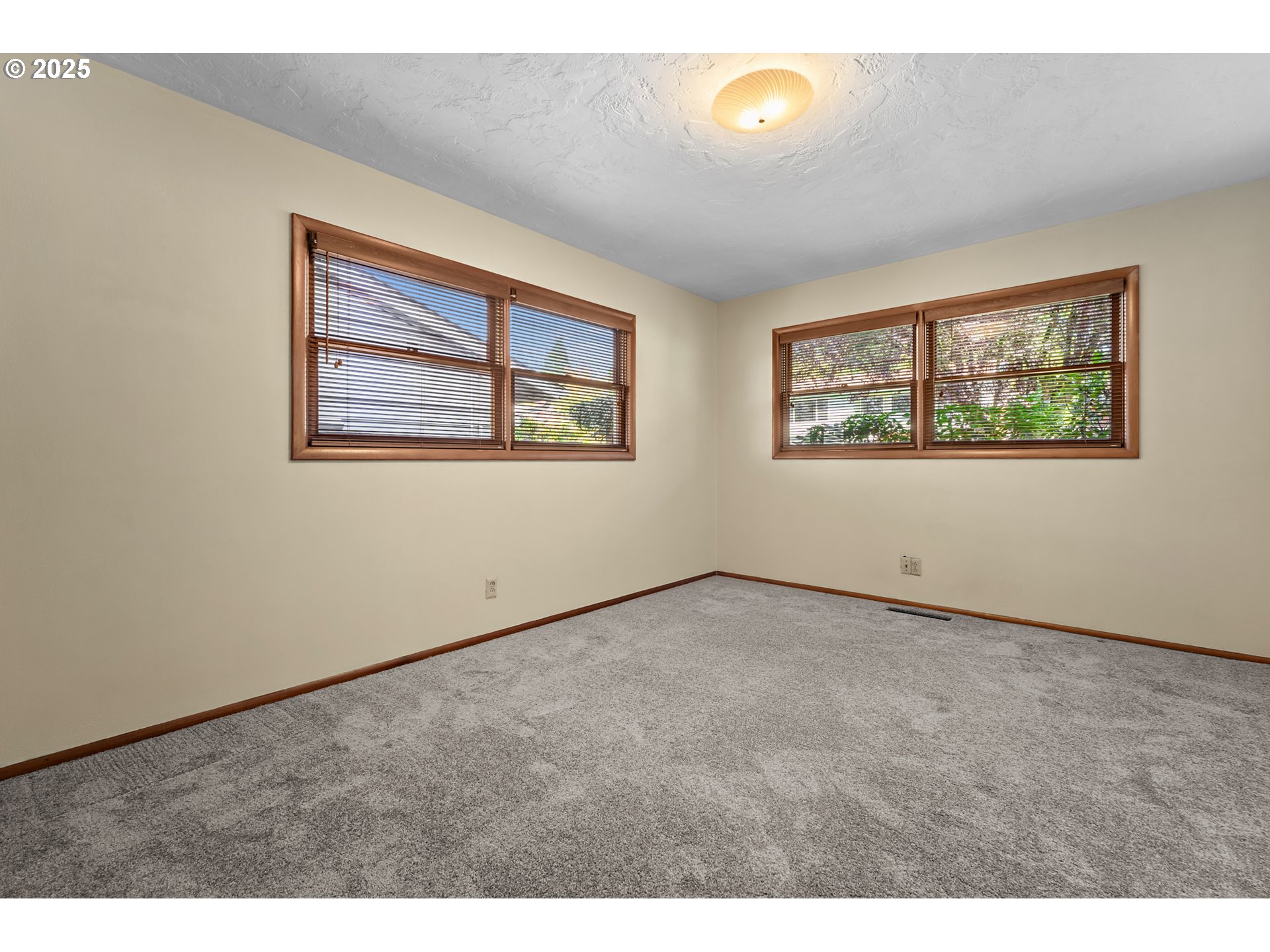 4430 Southeast Flavel Street Portland, OR 97206 - Photo 21 of 43 a view of an empty room with windows